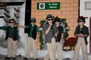 St. Helen School fourth-grader Vince Dimora sings “The Song of Sheep and Goats” with his backup Manger Boy singers Paul Ricci, Matthew Hart, Ricky Hoenigman and Tyler Fram during the school’s play, “Back to the Manger.”