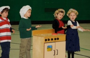 St. Helen School preschoolers (l to r) Isaac Sprogis, Anthony Montagna, Natalie Suvak and Madison Hilger perform a song during their play, “Christmas in the Kitchen.” 