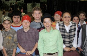 St. Helen School sixth-graders (l to r) front row: Monte Myer, Dane Berschig, Christopher Carter, Elliott Martin; and back row: Nate Looker, Danny Hoenigman, Jimmy Mislay, Joe Barcikoski and Nick Wozniak get ready to practice for their spring play, “Princess Whatsername.”