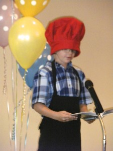 Jacob Schneider recites the poem, "A Pizza the Size of the Sun," during the third-grade poetry recital at St. Mary School.