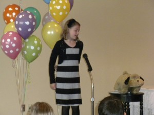 St. Mary School third-grader Sierra Berman recites "The Hairy Dog" during the poetry recital.