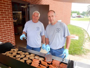 ubmitted Al and Tim Fenselon, from Fenselon Plumbing and "Friends of Mike's," grilled hot dogs and hamburgers for all students and staff on the last day of school. They donated their time and paid for all the food. Tim said, "We're giving back to those in the community who have given to us over the years."