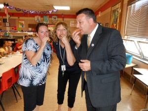 Submitted Taking a moment to enjoy a hot dog at Jordak Elementary School are (l to r) Julie Fulton, middle and high school assistant principal; Kelly Bearer, elementary and intermediate school principal; and Dr. Scott Hunt, Cardinal Schools superintendent.