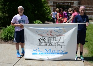 Submitted St. Mary School recently held its annual Square Mile March during which Megan Duffy and Sarah Boggs proudly carried the St. Mary School banner. 