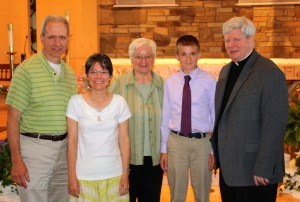 Submitted St. Helen School eighth-grader Nathan Lewandowski won the William Masley III Award, which is given to a person with a loving and caring spirit and who is a good sport. With Nathan are Ed and Theresa Lewandowski, Sr. Sandy and Fr. Jay.