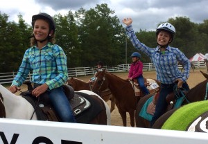 Submitted St. Helen School sixth-graders Diana Shale and Kalea Percic show off their horseback riding skills at The Great Geauga County Fair.