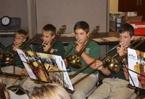 Submitted St. Helen School advanced band members, including (l to r) fifth-grader Justin Baker, sixth-grader Isaac Williford and eighth-graders John Ricci and Gabe Williford, are getting ready for their Christmas program. 
