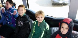 Submitted Fourth-graders Paige Fisher and Joslyn Borah and kindergartners Anthony Montagna and Sean Murphy get ready for their limousine ride and lunch at Mangia Mangia. They were among the students rewarded for selling a certain number of magazine subscriptions during the St. Helen School magazine drive.