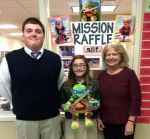 Submitted St. Helen School recently had a raffle to benefit the Notre Dame India Mission, which raised over $700. From left are seventh-grade teacher Pat Gannon; seventh-grader Anna Brent, winner of the Leonardo stuffed ninja turtle; and primary aide Carol Mead.