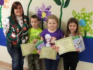The East Geauga Kiwanis Club recently gave recognition to third-graders from Burton Elementary School for being outstanding students as chosen by their teachers. They all received a certificate and four elementary fiction books from the club. From (l to r) are Mrs. Klingman, Kyle Boyk, Mariah Doolittle and Olivia Agins.
