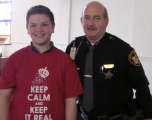 Submitted Andrew Watts, pictured with Deputy Lundstrom, is one of the winners of the D.A.R.E. essay contest at St. Helen School.