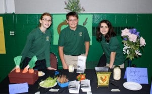 Submitted St. Helen School junior high health fair included demonstrations by (l to r) Maddie Fisher, Mason Mulacek and Cristina Hoenigman about the importance of growing healthy foods.