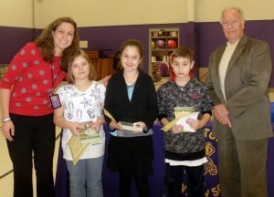 Submitted The East Geauga Kiwanis Club recently gave recognition to third-graders from Burton Elementary School for being outstanding students as chosen by their teachers. They all received a certificate and four elementary fiction books from the club. From (l to r) are Principal Mandy Randles, Brooklyn Pope, Madison Durosko, Maxwell Myers and Kiwanian Dave Hottenstein.