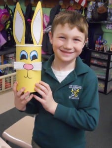 Submitted St. Helen first-grader Justin Romask has fun learning about recycling by transforming an oatmeal container into an Easter basket.