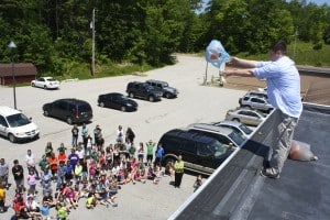 Submitted St. Helen staff and students watch anxiously as their engineered egg drop projects are being tested from the roof of St. Helen School.