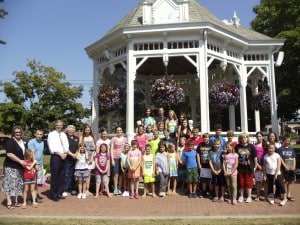 SUBMITTED The Chardon Library Book Buddies gathered for an ice cream social at the gazebo on Chardon Square to celebrate their summer reading. Twenty-nine Chardon elementary students completed at least six hours of reading activities with their teenage and adult volunteers. The buddies were each applauded by their proud parents, grandparents, Chardon Rotary member and school Superintendent Mike Hanlon and BOE member Karen Blankenship as they were presented with a copy of a Shel Silverstein book and certificates. The Chardon Rotary generously supports the Chardon Library Book Buddies with funds for the poetry books, ice cream party treats and miscellaneous supplies.