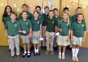 Submitted St. Helen School fifth-graders create thank-you chains for local firefighters, service people and the Geauga County Sheriff’s Department as part of a day of remembrance and service on Sept. 11.