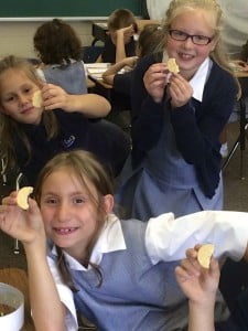Submitted Mrs. Teri Merkle's third-graders reinforced what they learned about the phases of the moon by making models. They made a "moon ring" and then changed the shape of a cookie into the different phases. Kaitlyn Boggs, Elaina Mardula and Katie Bennardo display their cookie models.
