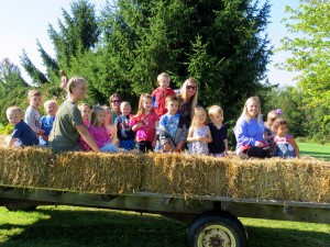 Submitted NDES preschool students take a hayride through the Sisters of Notre Dame Apple Orchard.