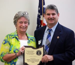 West Geauga Board of Education member Kathy Leavenworth accepts a 30-year service award from Reno Contipelli, OSBA northeast manager.