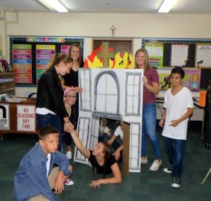 Submitted Re-enacting a scene from “The Outsiders” are eighth-graders (l to r) Gavin Sabath, Kelly McGraw and Marina Spuzzillo, all of Chardon; Emily Klika, of Newbury; Darby Leininger, of Chardon; Isabella Shubert, of Painesville; and Nicholas Zeolla, of Chardon.