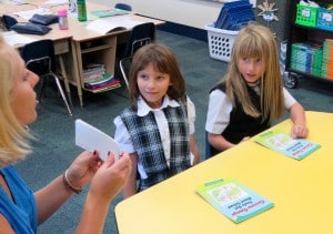 Submitted NDES first-grade teacher, Miss Taylor, uses small reading groups to provide individualized reading instruction to Remington Ball and Natasha Sutter.
