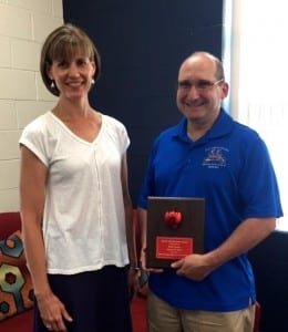 Submitted Kristin Gregory, West Geauga High School Science Department chairperson, presents Rich Levine, Kiwanis Club of West Geauga member, with the 2016 Friend of Education Award.