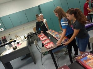 Submitted Cardinal Middle School students roll a ball down an inclined plane to test Galileo’s incline plane principle.