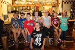 Submitted CMS students (l to r) back row: Caden G., Nathan O., Gabriel H., Hailey H., Emma G., Anna L., and Zoey Y.; and front row: Zander R enjoy a pizza making party at Vinny’s Authentic Italian Eatery in recognition of their summer reading efforts.