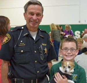 Sheriff Daniel McClelland and police dog Midge enjoy Grandparents Day with the sheriff’s grandson Jack Slattery.