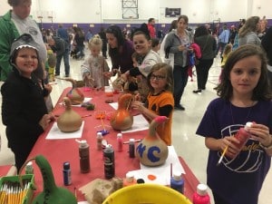 Submitted Burton Elementary School students decorate gourds during the school’s fall festival.