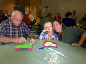 Submitted Keith and Diane Landies enjoy time with their grandson Grady during the St. Mary School celebration.
