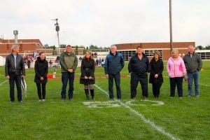 Submitted Members of the 2016 Hall of Fame class are recognized in a special ceremony prior to the varsity football game on Sept. 30. From left are Kevin Pollari; Amy Lukas; Dr. Felicia Ladd-Dixon and her husband; Don Hostetler; the parents of inductee Jason Driscoll; and the parents of inductee Josh Yoder.