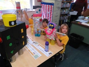 Submitted Kindergartners (l to r) Ignacio Romero and Elena Dixon display the robots they created in math class.