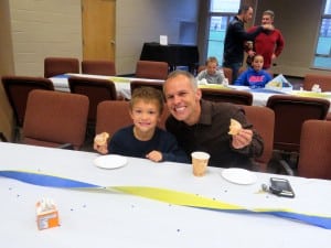 Submitted NDES student Leonardo DiSanto enjoy donuts with his dad, Gilbert, of Russell Township, before school on Oct. 14.