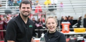 Submitted Cardinal High School senior Megan T. receives the R+L Hometown Achievement Award from R+L Carriers at midfield prior to the football game on Sept. 30.