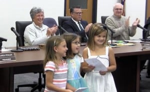 Submitted Elementary students Gianna Lallitto, Kendall Moidell and Brooklyn Osolin share examples of their work at the West Geauga Board of Education meeting.