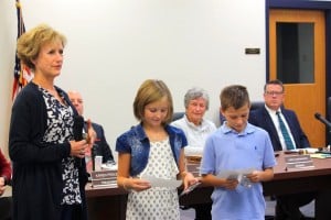 Submitted Lindsey Elementary School third-grade teacher Christine Howell shares new literacy initiatives being implemented at the district’s elementary schools during a recent school board meeting while students Ava Gibson and Matthew Furst provide examples of their work.