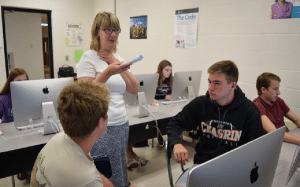 Mrs. Carolyn Petite instructs her computer science students.