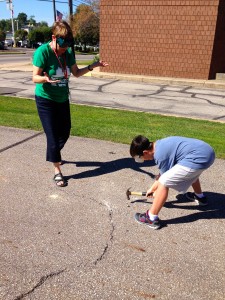Submitted Alongside teacher Barbara Tropf, third-grader Braiden L. dons safety goggles and uses a hammer to test the strength and characteristics of a rock. The experiment tied in with a recent lesson in earth and space science.