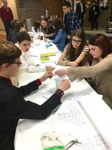 Submitted Berkshire seniors Jacob Turk, Gabe Orlowski, Audrey Walsh and Denise Peterson work together to build a paper tower in a team building exercise.