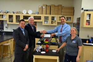 Submitted Students in Christian Barrus’ physics classes are using a First Energy Educator Grant to adapt toys for special needs children. From left are Principal Tom Gabram, First Energy’s Dave Dillion, Barrus and Natalie Wardega, of RePlay for Kids.