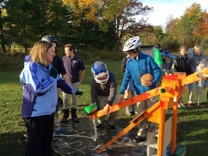 Submitted Science teacher Amber Yeager assists a team during the Punkin Chuckin competition.