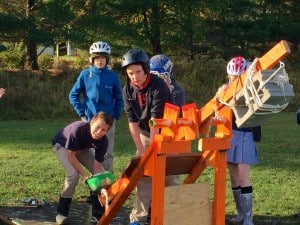 Submitted Teammates Max Buzogany, Jack Norton and Andrew Ryan get ready to launch their catapult.