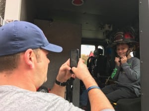 Submitted Middlefield Fire Department Lt. Ben Reed takes a photo of kindergartener Landon H. in the fire truck. The MFD visited the class for National Fire Safety Week.