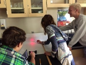 Submitted Kenston High School students calculate the wavelength of light in physics class.