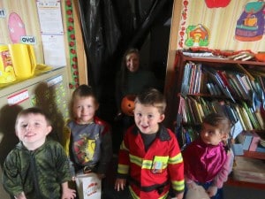 Submitted Preschoolers (l to r) Blake Christopher, Matthew Wilcox, Joey Philippone and Betty Petti have fun trick or treating at school while their teacher, Mrs. Wilcox, looks on.