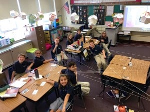 Submitted St. Mary students end up trapped friendship web of string in math class.