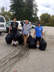 Submitted Mitchell Johnson, Stephen Kruszenski and Alex Amata deliver goods to the Chagrin Falls Park Community Center.