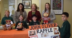 Submitted Congratulations to the winners of the John Oliver Zippay Raffle. John Oliver is a preschool student at St. Helen School who is battling leukemia. Students, staff and friends raised money for the Zippay family by holding the raffle. From left to right are Emily Cook, who won the Cavs bear; Alexandria Thieret, who won the Browns bear; Joey Lemmo, who won the Indians Cap and ball; and third-grade teacher, Miss Reichard, who won the Ohio State bear. Holding the sign is Wyatt Fuhry. In the back row are (l to r) Mrs. Mary Wanner and Mrs. Carol Mead who donated the prizes and organized the raffle.